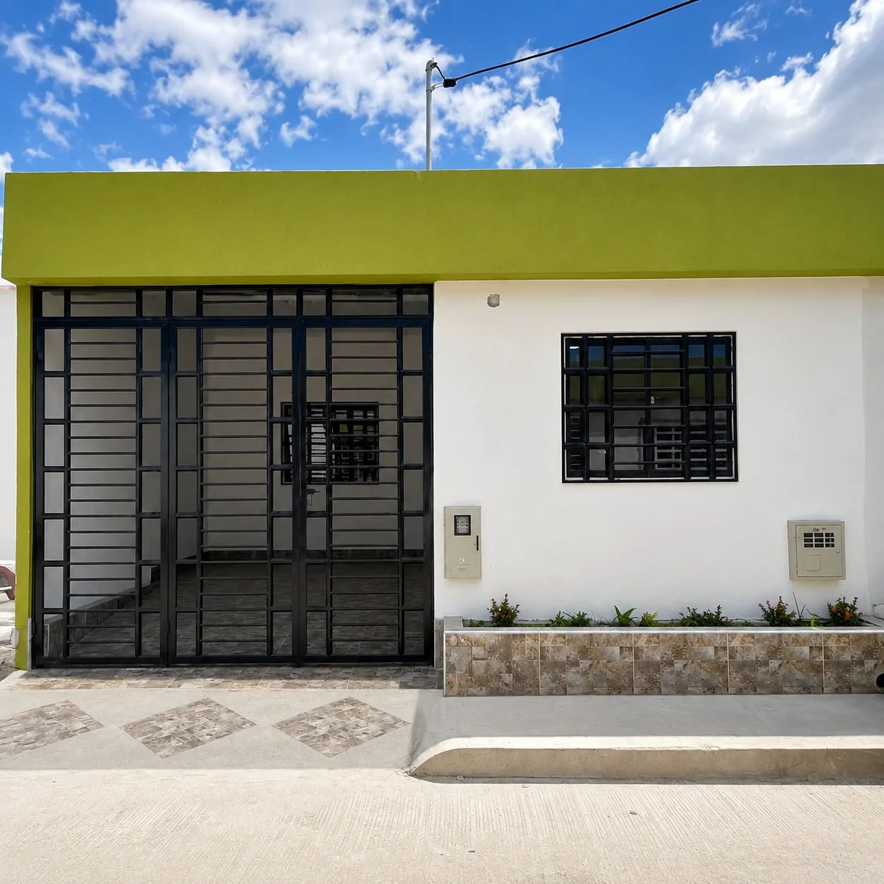 Fachada verde y blanca de una casa nueva en Coruña de Berdez